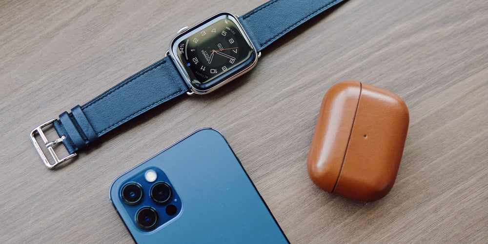 iphone watch and airpod cover on table